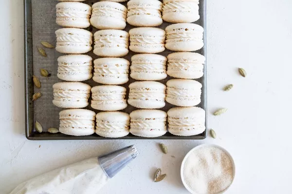 domino golden sugar macarons with cardamom cream cheese filling