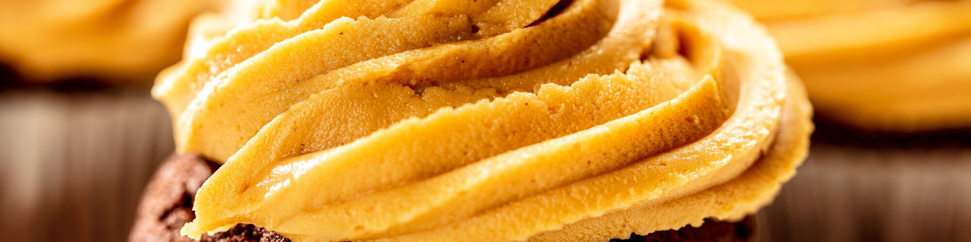 cupcakes with peanut butter frosting made with domino powdered sugar