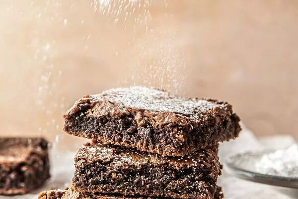 gingerbread brownies sprinkled with domino powdered sugar