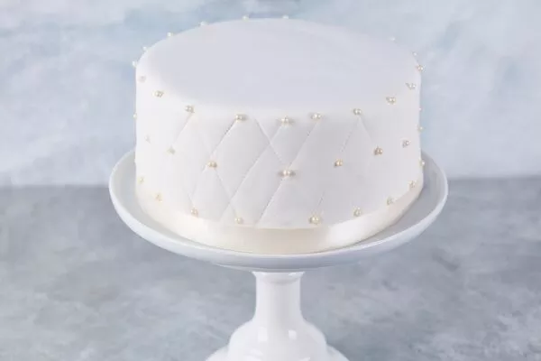 cake decorated with marshmallow fondant made with domino powdered sugar