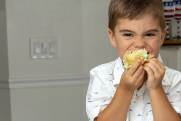 child eating domino sugar stuffed cookie dough cupcakes