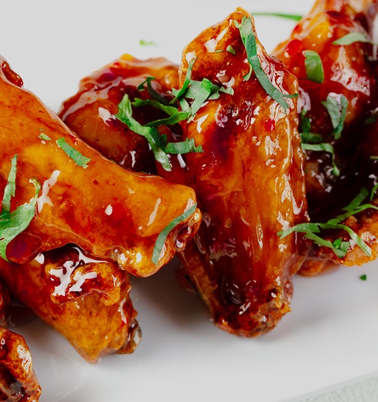 air fryer chicken wings and sweet chili sauce made with domino light brown sugar.