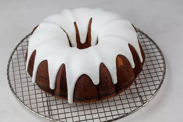 bundt cake topped with domino powdered sugar glaze