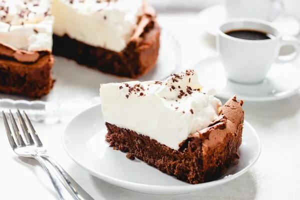 flourless chocolate cake baked with domino golden sugar and powdered sugar whipped topping