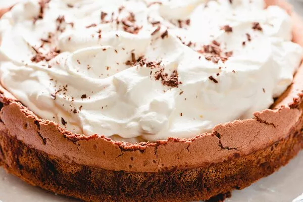 flourless chocolate cake baked with domino golden sugar and powdered sugar whipped topping