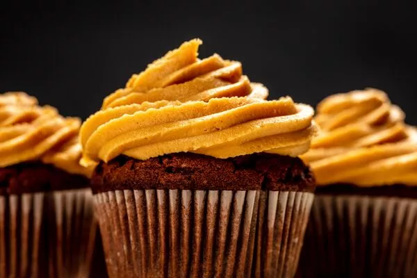 cupcakes with peanut butter frosting made with domino powdered sugar