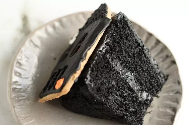 slice of spooky gingerbread house cake baked with domino dark brown sugar