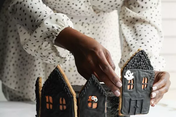 spooky gingerbread house cake with domino dark brown sugar