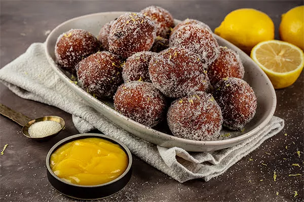 lemon ricotta doughnuts baked and coated with domino golden sugar