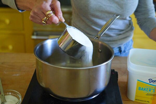 #2 Sprinkle the Domino® Baker’s Sugar™ in an even layer over the bottom of a heavy-bottomed pot on the stovetop
